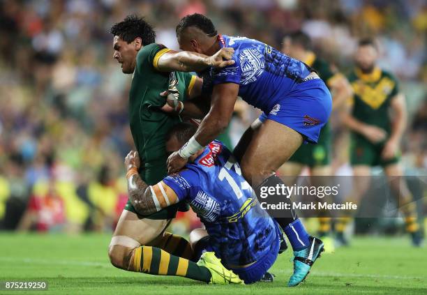 Jordan Mclean of Australia is tackled during the 2017 Rugby League World Cup Quarter Final match between Australia and Samoa at Darwin Stadium on...