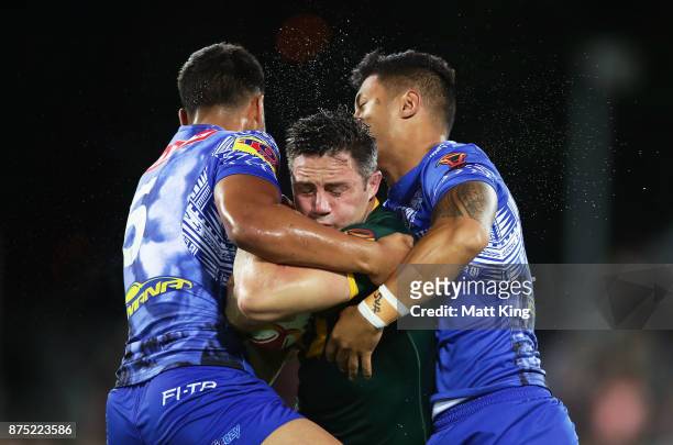 Cooper Cronk of Australia is tackled during the 2017 Rugby League World Cup Quarter Final match between Australia and Samoa at Darwin Stadium on...