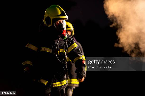firefighters - respirator mask stock pictures, royalty-free photos & images