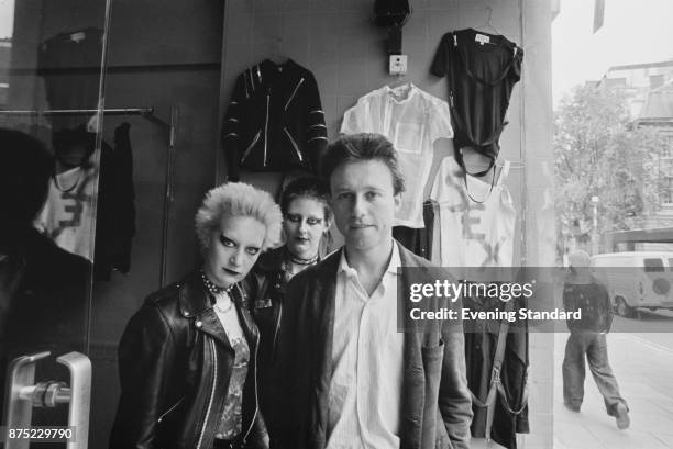 John Krivine, co-founder of fashion brand Boy London, with two customers, Suby and Caroline, London, UK, 16th September 1977.