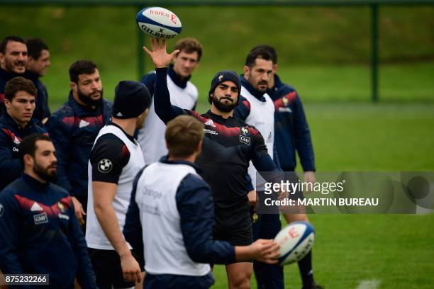 French rugby union national team wing Yoann Huget warms up during a captain's run session in Marcoussis near Paris on November 17 on the eve of the...