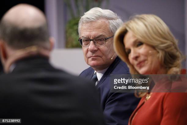 Jean Lemierre, chairman of the board at BNP Paribas, center, looks on during a panel discussion at the European Banking Congress on the final day of...