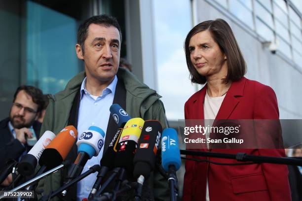Cem Oezdemir and Katrin Goering-Eckardt speak to the media as they arrive for further talks the morning after leaders of the four negotiating parties...