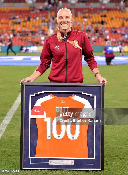 Tameka Butt of the Roar is presented with a momento for playing 100 games for the Brisbane Roar after the round four W-League match between Brisbane...