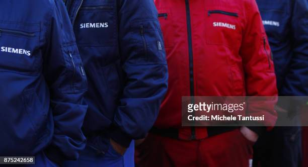 Workers employed by German engineering company Siemens protest pending layoffs in front of the Siemens dynamo factory on November 17, 2017 in Berlin,...