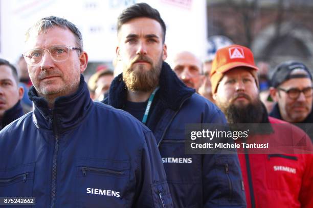 Workers employed by German engineering company Siemens protest pending layoffs in front of the Siemens dynamo factory on November 17, 2017 in Berlin,...