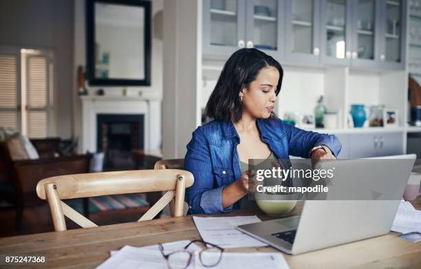 managing her time like a pro - telecommuting eating stock pictures, royalty-free photos & images