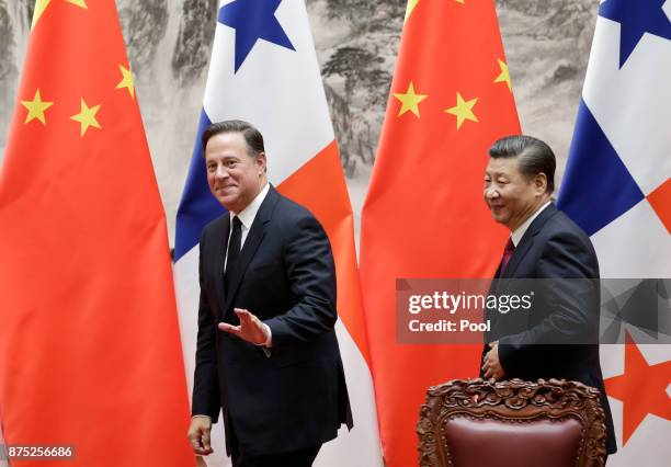 Panama's President Juan Carlos Varela and China's President Xi Jinping leave after a signing ceremony on November 17, 2017 in Beijing, China....