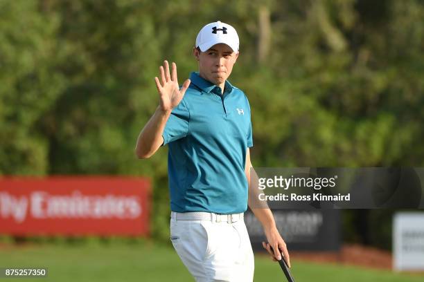 Matthew Fitzpatrick of England acknowledges the crowd on the 18th green during the second round of the DP World Tour Championship at Jumeirah Golf...