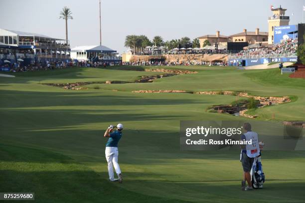 Matthew Fitzpatrick of England hits his second shot on the 18th hole during the second round of the DP World Tour Championship at Jumeirah Golf...