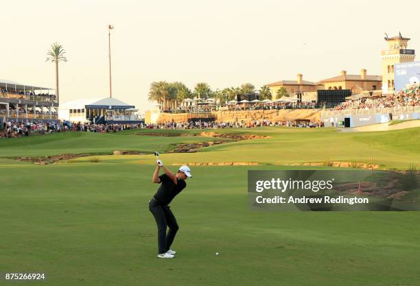 Justin Rose of England hits his second shot on the 18th hole during the second round of the DP World Tour Championship at Jumeirah Golf Estates on...