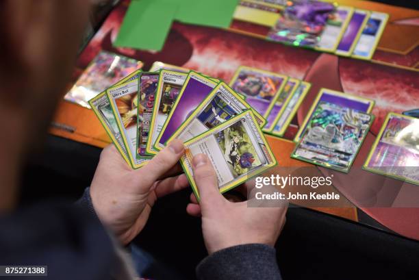 Competitor checks their hand at the Pokemon European International Championships at ExCel on November 17, 2017 in London, England. Thousands of...