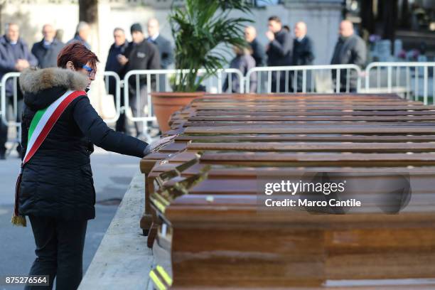 One of the mayors of Salernitan communes pays homage to the coffins, during the funeral of the 28 migrant women who died in a shipwreck as they...