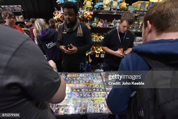 Attendees purchase Pokemon merchandise at the Pokemon European International Championships at ExCel on November 17, 2017 in London, England....