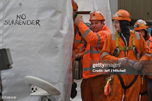 Group of workers gather at the entrance gate to the Burntisland yard of engineering company BiFab, where staff are continuing a work-in despite the...