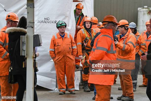Group of workers gather at the entrance gate to the Burntisland yard of engineering company BiFab, where staff are continuing a work-in despite the...