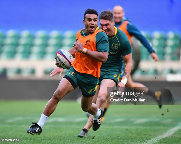 Will Genia of Australia evades team mate Sean McMahon during the Australia Captain's Run at Twickenham Stadium on November 17, 2017 in London,...