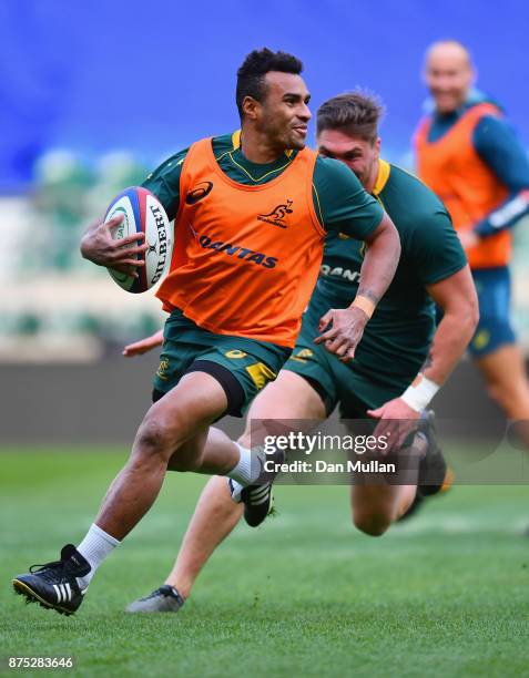 Will Genia of Australia evades team mate Sean McMahon during the Australia Captain's Run at Twickenham Stadium on November 17, 2017 in London,...