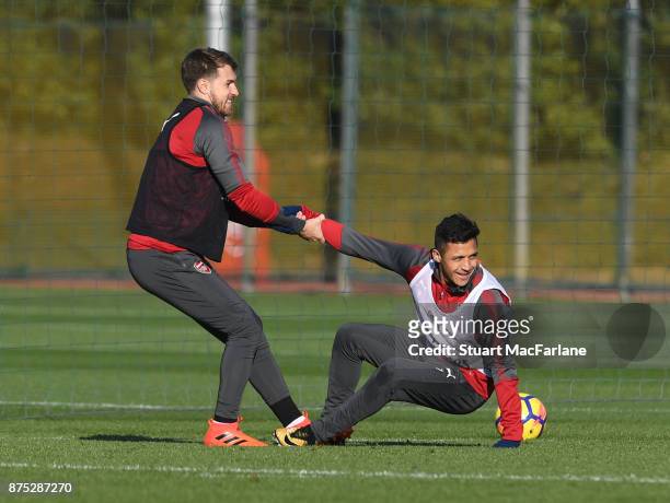 Aaron Ramsey and Alexis Sanchez of Arsenal during a training session at London Colney on November 17, 2017 in St Albans, England.