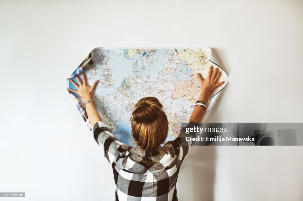 Young woman looking at map