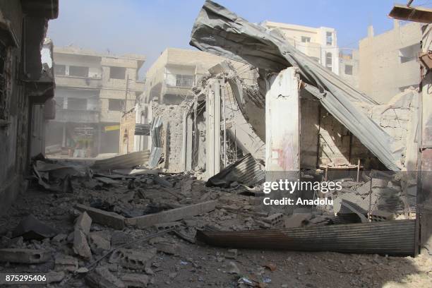 Damaged buildings are seen after Assad regime's warcrafts carry out airstrikes over residential areas of Arbin town of the Eastern Ghouta region of...