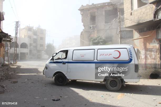 An ambulance is seen after Assad regime's warcrafts carry out airstrikes over residential areas of Arbin town of the Eastern Ghouta region of...