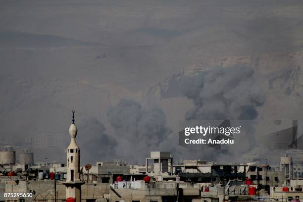 Smoke rises after Assad regime's warcrafts carry out airstrikes over residential areas of Arbin town of the Eastern Ghouta region of Damascus in...