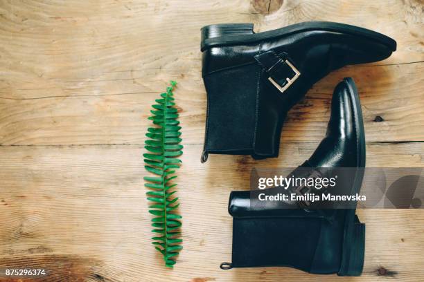 pair of black woman shoes - black boot fotografías e imágenes de stock
