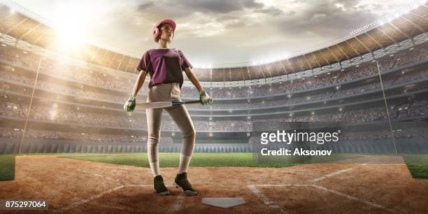 softball female player on a professional arena - softball glove stock pictures, royalty-free photos & images
