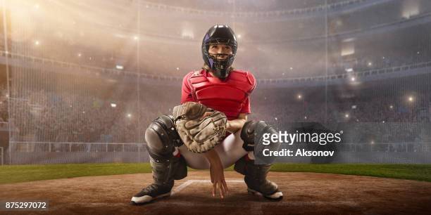 softball female catcher on a professional arena - baseball catcher stock pictures, royalty-free photos & images