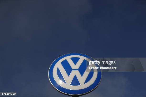 The Volkswagen AG logo stands outside automaker's headquarters ahead of news conference in Wolfsburg, Germany, on Friday, Nov. 17. 2017. Volkswagen...