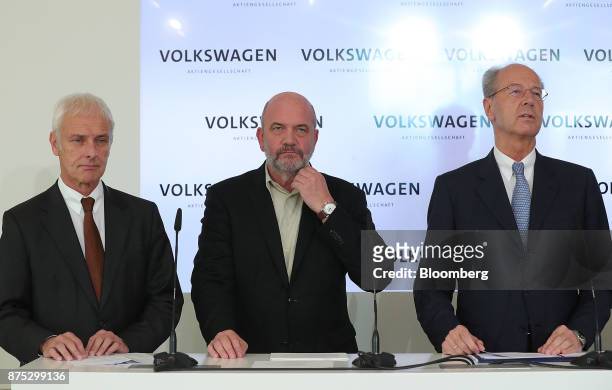 Matthias Mueller, chief executive officer of Volkswagen AG, right, speaks as Matthias Mueller, chief executive officer of Volkswagen AG, left and...
