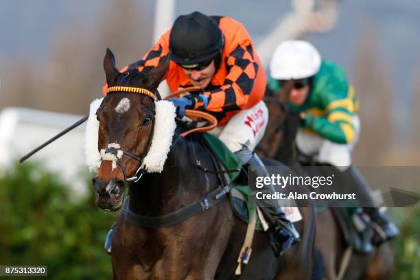 Tom Scudamore riding Kingswell Theatre clear the last to win The Glenfarclas Cross Country Handicap Steeple Chase at Cheltenham racecourse on...