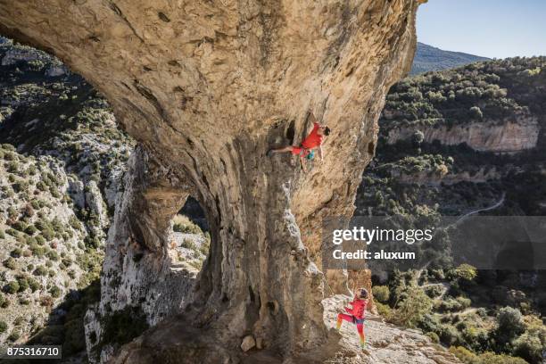 rock climbing rodellar aragon spain - belaying stock pictures, royalty-free photos & images