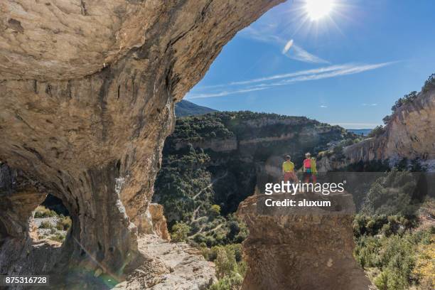 rock climbers in rodellar aragon spain - women rock climbing stock pictures, royalty-free photos & images