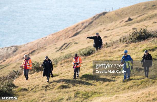 Police and other search and rescue agencies perform a search in the open space above the coast near to Swanage in Dorset as they continue to...