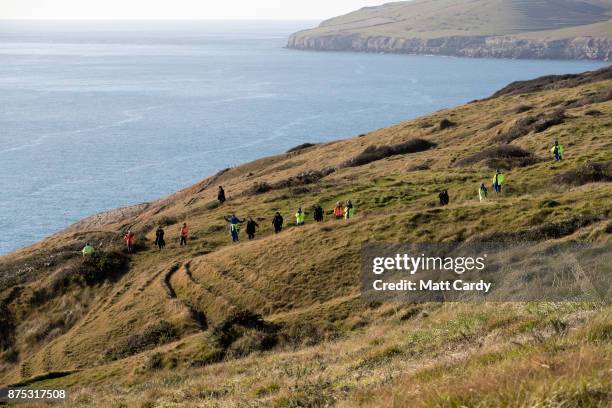 Police and other search and rescue agencies perform a search in the open space above the coast near to Swanage in Dorset as they continue to...