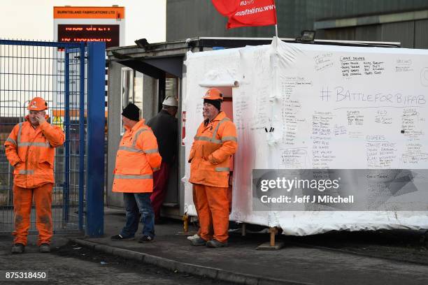 Group of workers gather at the entrance gate to the Methil yard of engineering company BiFab, where staff are continuing a work-in despite the firm...