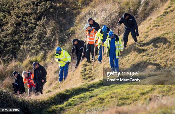 Police and other search and rescue agencies perform a search in the open space above the coast near to Swanage in Dorset as they continue to...