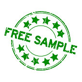 Grunge green free sample with star icon round rubber seal stamp on white background