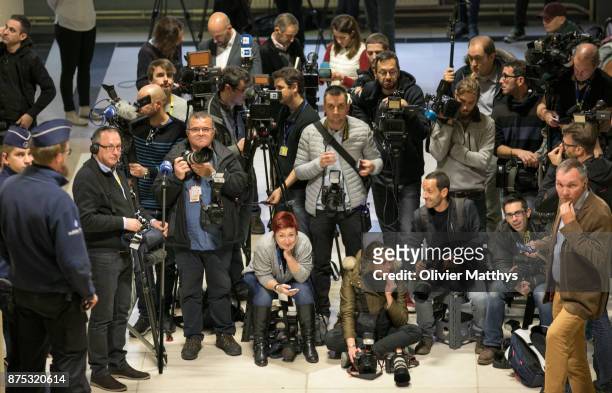 Members of the international press wait for former minister-president of Catalonia, Carles Puigdemont and former members of his regional government...