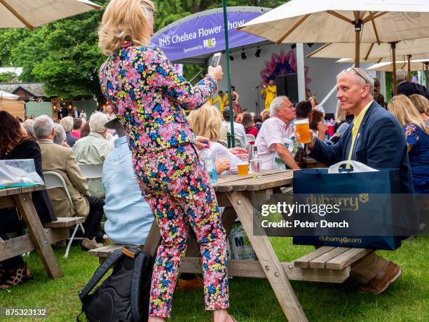 An appropriately themed outfit for one female visitor to Chelsea Flower Show. The RHS Chelsea Flower Show, is a garden show held for five days in May...