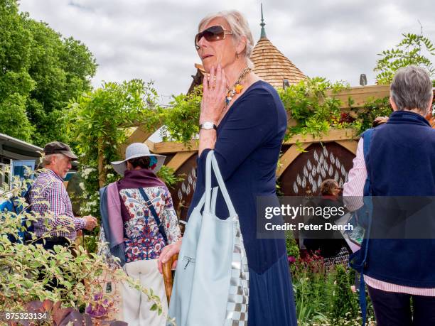 An elderly visitor to Cheslea Flower Show. The RHS Chelsea Flower Show, is a garden show held for five days in May by the Royal Horticultural Society...