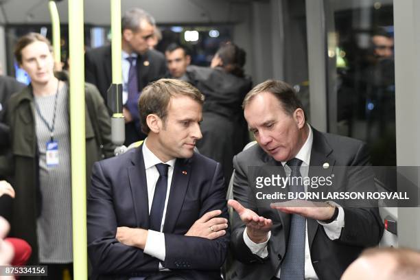 France's President Emmanuel Macron and Sweden's Prime Minister Stefan Lofven travel by bus to visit the Volvo Campus Lundby of the Swedish carmaker...