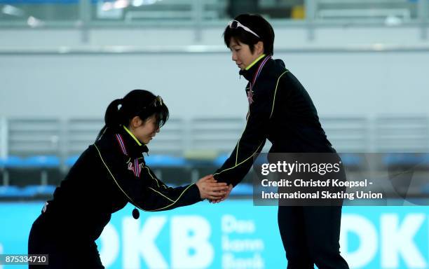 Nao Kodaira of Japan shake hands with second placed #Miho Takagi of Japan during the medal ceremony of the ladies 1000m Division A race of Day 1 of...