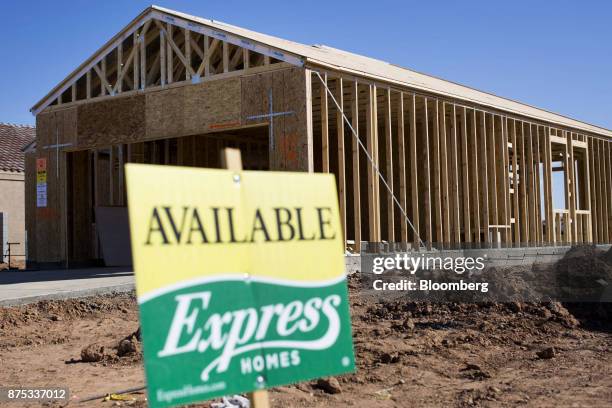 Home under construction is seen past an "Available" sign at the D.R. Horton Express Homes Magma Ranch housing development in Florence, Arizona, U.S.,...