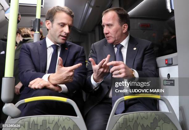 France's President Emmanuel Macron and Sweden's Prime Minister Stefan Lofven travel by bus to visit the Volvo Campus Lundby of the Swedish carmaker...