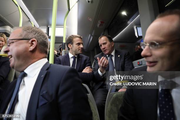 France's President Emmanuel Macron and Sweden's Prime Minister Stefan Lofven travel by bus to visit the Volvo Campus Lundby of the Swedish carmaker...