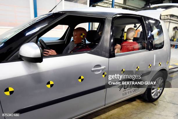 Car is pictured before a frontal crash test with another car, without a safety belt buckled in the back seat, as part of France's Road Safety...