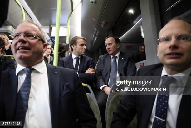 France's President Emmanuel Macron and Sweden's Prime Minister Stefan Lofven travel by bus to visit the Volvo Campus Lundby of the Swedish carmaker...